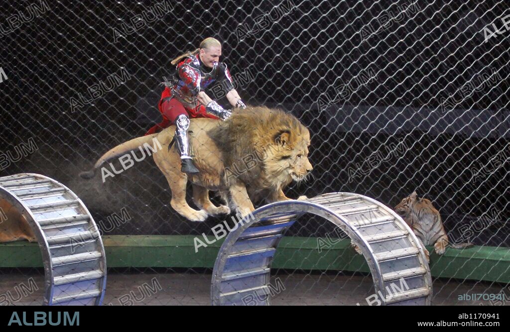Mar 24, 2009 - St. Petersburg, Russian Federation - Zapashny Brothers' Circus , Lions and Tigers Show 'Camelot'. Pictured: ASKOLD ZAPASHNY and his lion. 24/03/2009