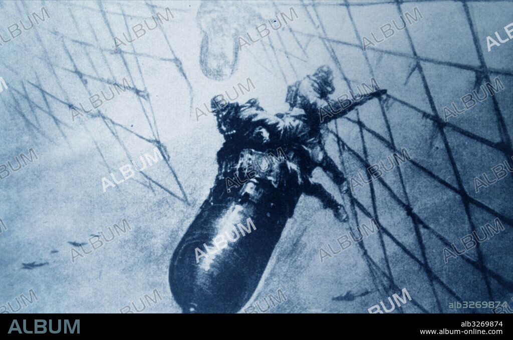 Illustration depicting Italian torpedo riders leading a torpedo through the cut net during the Second World War. Dated 20th Century.