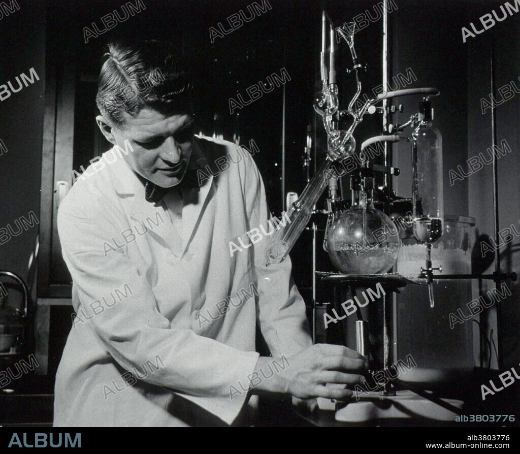 Anfinsen wearing white lab coat, working with chemical apparatus in laboratory. Christian Boehmer Anfinsen, Jr. (1916-1995) was an American biochemist. He shared the 1972 Nobel Prize in Chemistry with Stanford Moore and William Howard Stein for work on ribonuclease, especially concerning the connection between the amino acid sequence and the biologically active conformation.  Anfinsen published more than 200 original articles, mostly in the area of the relationships between structure and function in proteins. He was also a pioneer of ideas in the area of nucleic acid compaction.
