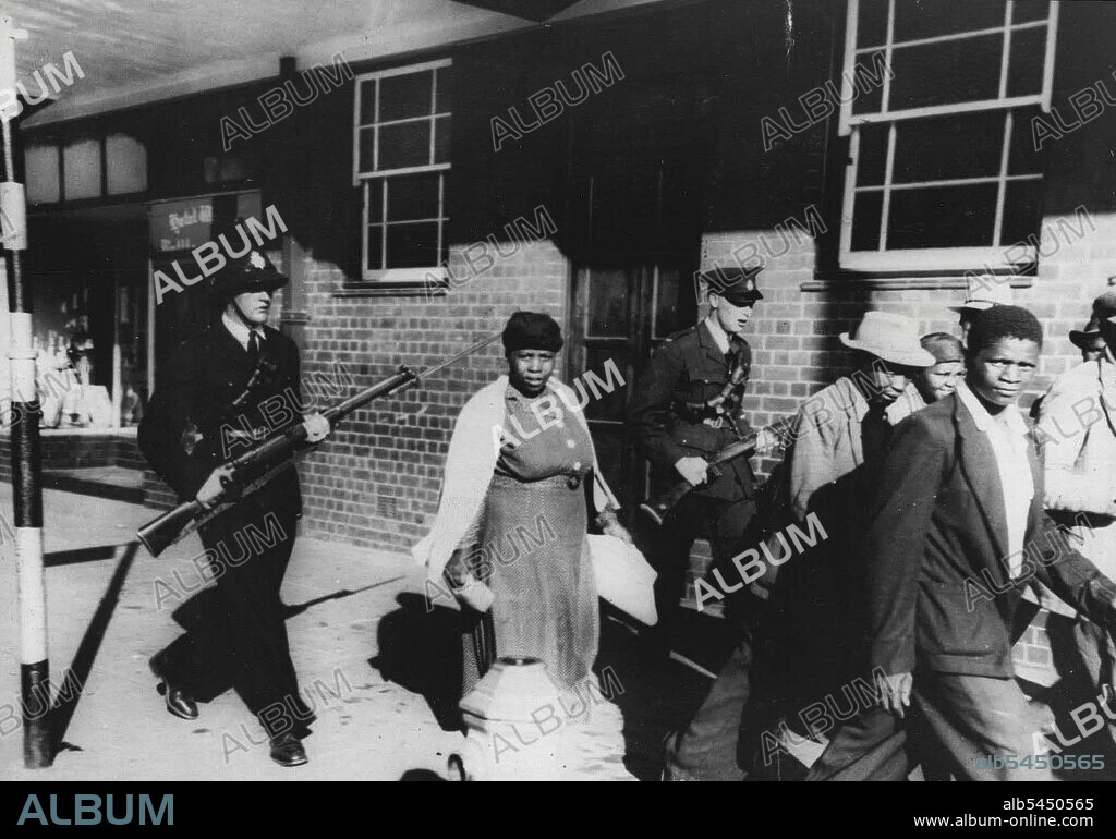 Round-up after African race riots.A policeman and an armed militiaman - with fixed bayonets - clearing one of the streets of this South African city (capital of Natal) of 'truculent' natives after the recent racial riots which spread here after the flare up in Durban. January 24, 1949.