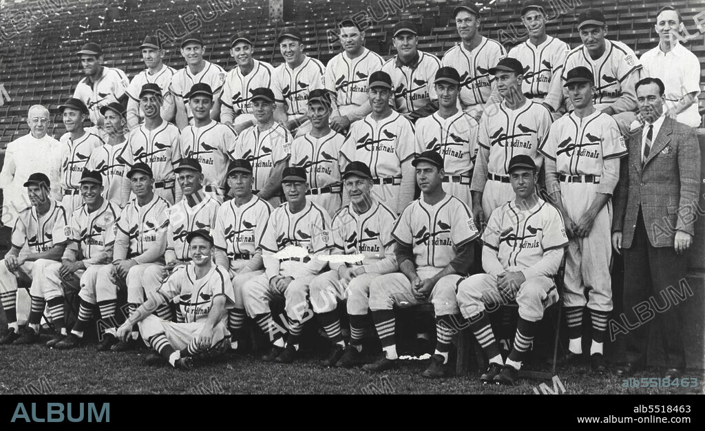 Winners Of 1942 Pennant In The National League -- These are the proud faces of the St. Louis Cardinals, winners of the National League pennant after a sensational home-stretch race in which they clinched the flag from the Brooklyn Dodgers on the final day of the season. Left to right are: Front row, Marty Marion, Stan Musial, John Hopp, Coach Mike Gonzales, Manager Billy Southworth, Coach Buzzy Wares, George Kurowski, Sam Narron and Ken O'Dea; Second row, Dr. H. J. Weaver, trainer; Bill Beckman, Jimmy Brown, Harry Walker, John Beazley, Ernio White, Enos Slaughter, Harrry Gumbert, Howard Pollet, Walker Cooper, Jeoffrey Cross and Loo Ward, secretary; Back row, Frank Crespi, Coaker Triplett, Ervin Dusak, Ray Sanders, Terry Moore, Max Lanier, Morton Cooper, Howard Krist, Murry Dickson, Lloyd Moore, and "Butch" Yatkeman, clubhouse attendant. Arthur Potors, bat boy is seated in front. January 07, 1945. (Photo by U.S. Office of War Information Picture).