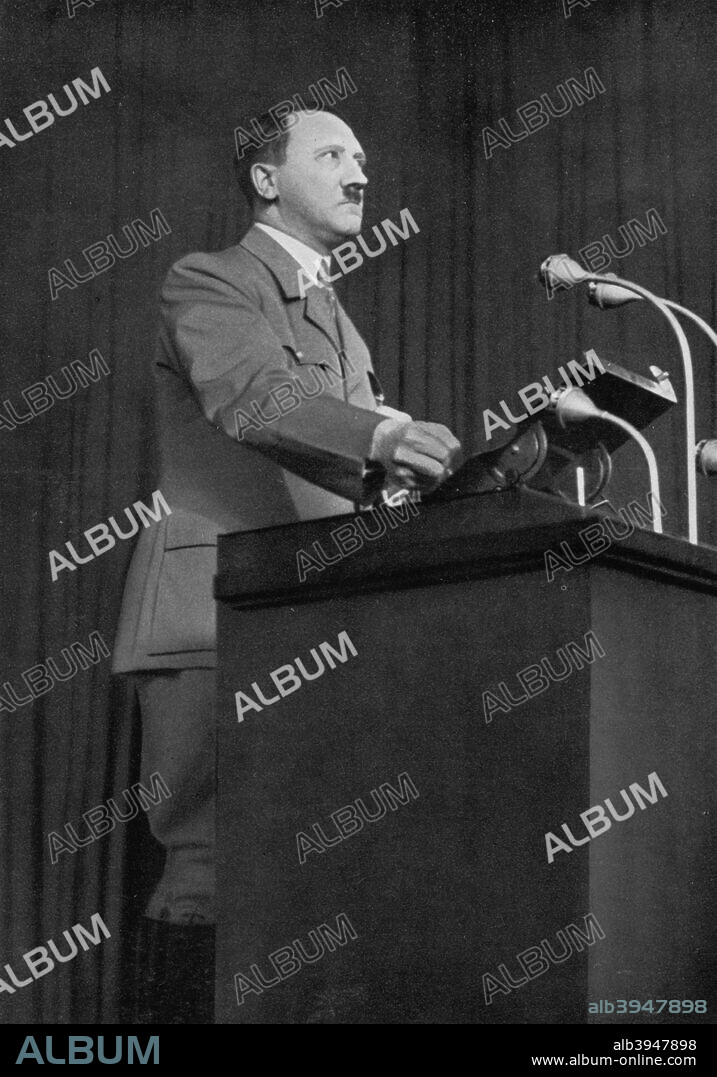 Adolf Hitler delivering a speech, March 1936. Hitler (1889-1945) speaking on Germany's freedom during the election campaign. A print from Adolf Hitler. Bilder aus dem Leben des Führers, Hamburg: Cigaretten/Bilderdienst Hamburg/Bahrenfeld, 1936.