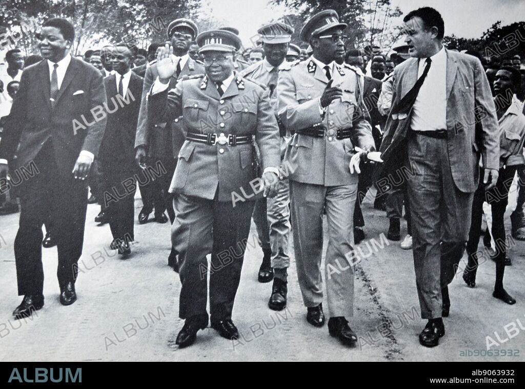Coalition formed to govern the Congo 1963. Leaders march through the capital to show unity.Moise tshombe (left), Joseph Kasavubu (centre) and Joseph Mobutu (2nd from right).