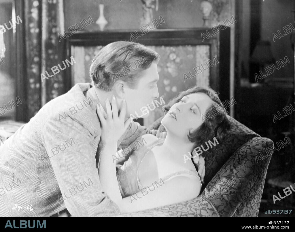JOAN CRAWFORD and OWEN MOORE in THE TAXI DANCER, 1927, directed by HARRY F. MILLARDE. Copyright M.G.M.