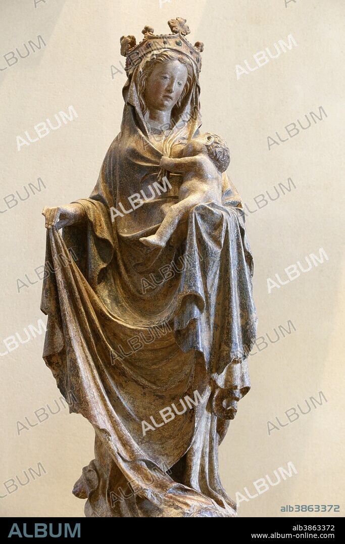 Louvre museum. Stone statue depicting the Virgin mary breast feeding Jesus. Picardy, around 1400. France.