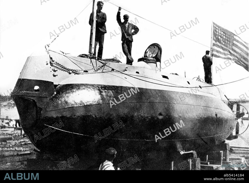 Starboard side view of USS Holland (SS-1) in dry dock. USS Holland (SS-1) was the U.S. Navy's first modern commissioned submarine. The boat was originally laid down as Holland VI at the Crescent Shipyard for John Holland's Holland Torpedo Boat Company, and launched in 1897. She was acquired by the USN in 1900. The US Government soon ordered more submarines, which were to be known as the Plunger class. These became America's first fleet of underwater naval vessels. Courtesy of the Submarine Force Library and Museum (cropped and cleaned).