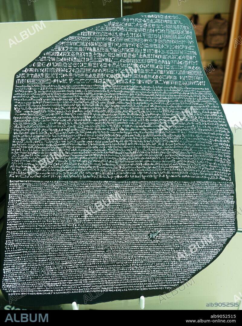 Replica of the Rosetta Stone a granodiorite stele, found in 1799, inscribed with three versions of a decree issued at Memphis, Egypt, in 196 BC during the Ptolemaic dynasty on behalf of King Ptolemy V. The top and middle texts are in Ancient Egyptian using hieroglyphic script and Demotic script, respectively, while the bottom is in Ancient Greek. As the decree has only minor differences between the three versions, the Rosetta Stone proved to be the key to deciphering Egyptian hieroglyphs. The stone, carved during the Hellenistic period.