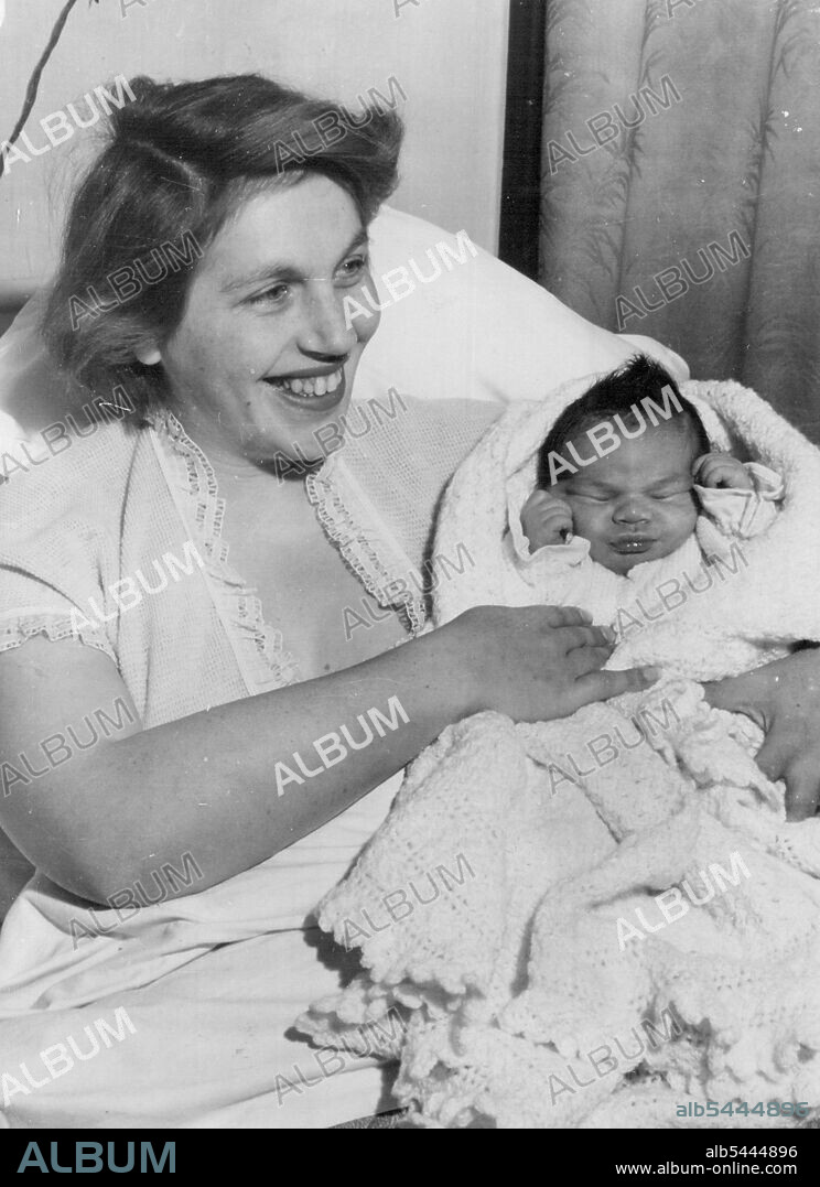 Hypnosis Birth for Shinwell's Grandson Mrs. Peggy Shinwell, wife of Mr. Ernest Shinwell, son of the Defence Minister, gave birth to a boy under medical hypnotism at the West Dulwich Clinic early today. The boy weighted eight pounds. Fewer than ten hours after baby was born, I found 30-year-old Mrs. Shinwell sitting ***** in bed and receiving visitor. "I feel wonderful and walked back from the labour ward to my room as soon as my son was born," she told me. "I was conscious of what was happening, but did not feel any pain. I can remember everything perfectly. "As I had my pre-natal examinations under hypnotism I have felt no pain" at any stage at all." Proudly holding her baby, Mrs. Shinwell said the most important aspect of hypnotic birth was that the mother felt relatively fresh and relaxed after the baby was born and was not so exhausted. February 03, 1951. (Photo by The Daily Mail Contract Picture).