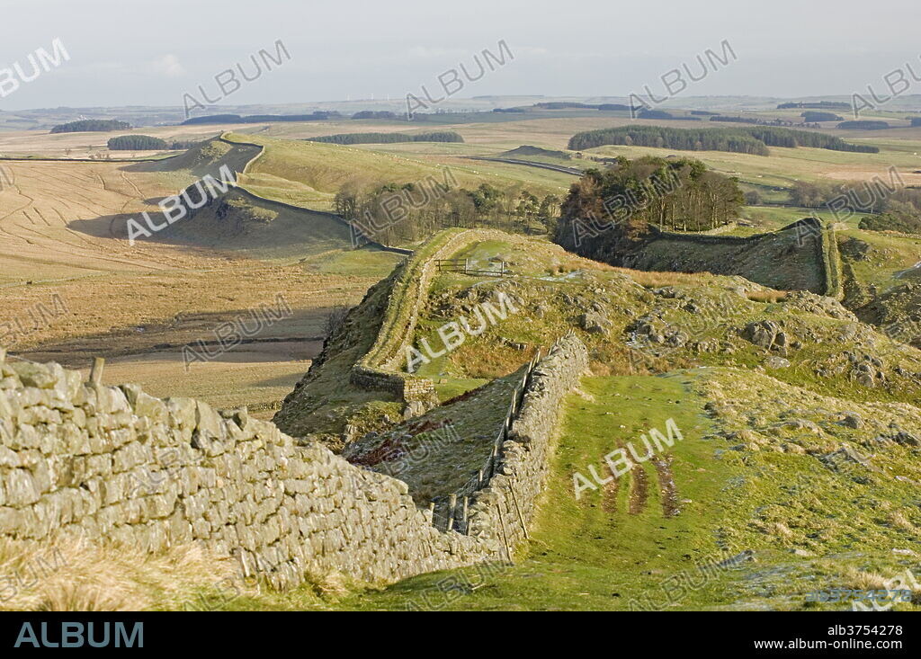 Looking east from Holbank Crags showing course of the Roman wall past Housesteads Wood to Sewingshields Crag, Hadrian's Wall, UNESCO World Heritage Site, Northumbria (Northumberland), England, United Kingdom, Europe.