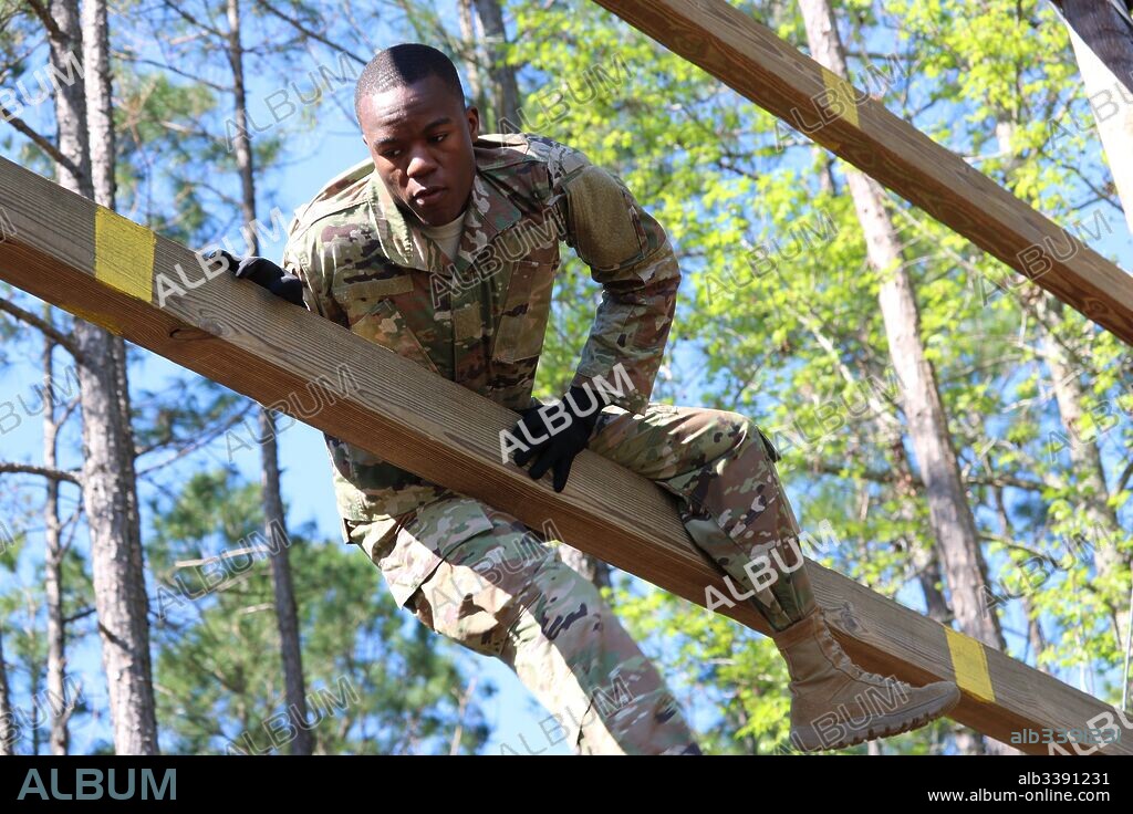 Sgt Franswu Lloyd, of the Georgia Army National Guard's 201st Regional Support Group, competes in the Georgia National Guard Best Warrior Competition's obstacle course event held at Fort Stewart, March 10, 2017. Image courtesy Sgt. James Braswell/National Guard.
