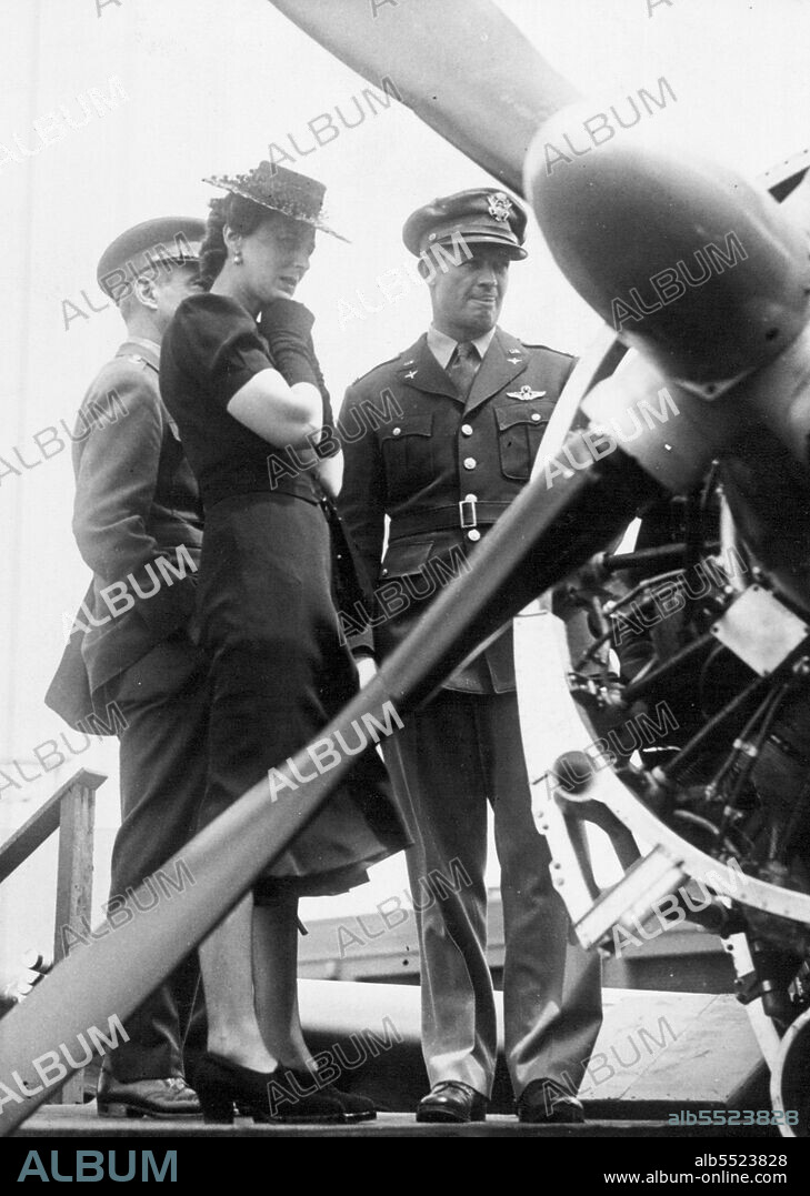 The Duchess of Kent inspecting the engine of one of the latest fighters - the "Thunderbolt".Duchess of Kent presents RAF crests to commemorate part played by eagle Squadrons during battle of Britain - the crests were given by Royal House hold and approved by the king. June 24, 1943.