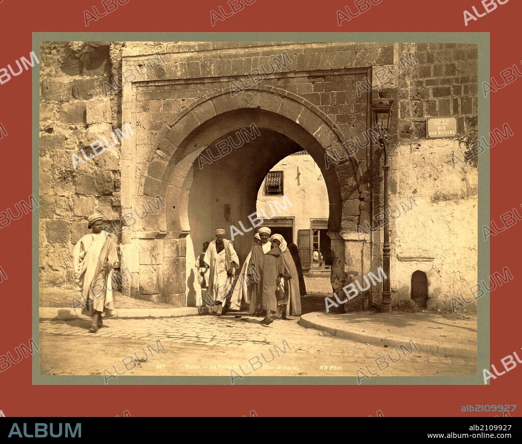Tunis, La Porte de la Folle, Bab Menara, Tunisia, Neurdein brothers 1860 1890, the Neurdein photographs of Algeria including Byzantine and Roman ruins in Tébessa and Thamugadi; mosques, shrines, public buildings, palaces, and street scenes in Mostaganem, Biskra, Algiers, Tlemcen, Constantine, Oran, and Sidi Bel Abbès; and the cathedral at Carthage. Portraits of Algerian people include Berbers, Ouled Naïl women, and prisoners in Annaba. Tunisian views include mosques, buildings, and street scenes in Tunis.