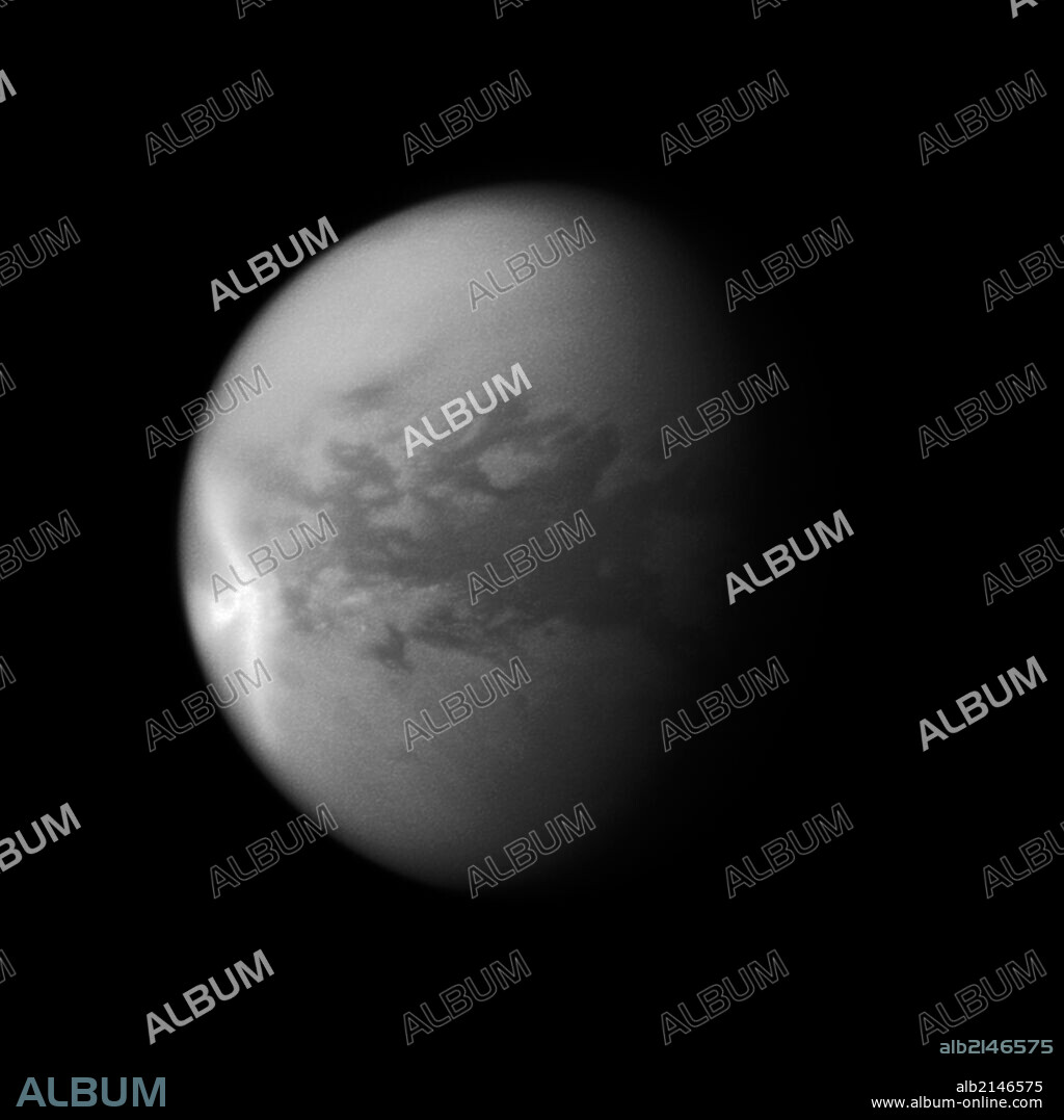A huge arrow-shaped storm blows across the equatorial region of Titan in this image from NASA's Cassini spacecraft, chronicling the seasonal weather changes on Saturn's largest moon. (Photo by: Universal History Archive/UIG via Getty Images).