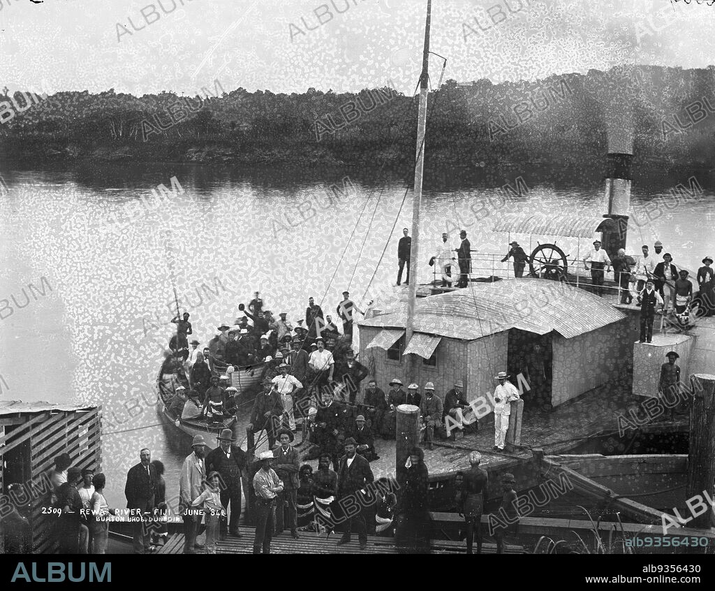 Rewa River, Fiji, June '84, Burton Brothers studio, photography studio, 1884, New Zealand, black-and-white photography, Large group of passengers standing on the deck of the berthed 'Wairarapa'. There is also a group of Europeans and Fijians standing on the wharf.