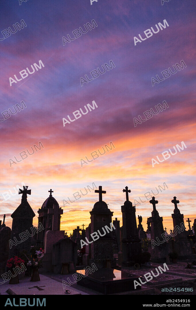 Dramatic sunset over the crosses, Llucmajor Cemetery, Mallorca, Balearic Islands, Spain.