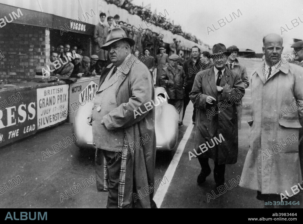 Alfred Neubauer, Mercedes team manager, 1954. In 1926, Neubauer (left), took over as manager of the Mercedes-Benz racing team, bringing in many innovative practices and presiding over its many successes until 1955. The company pulled out of racing in 1955 after one of their cars was involved in a disastrous crash at Le Mans, and Neubauer retired shortly afterwards.