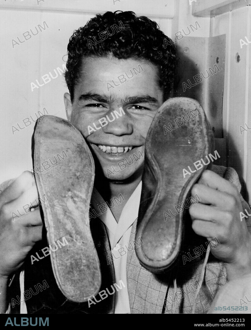 Australia's most remarkable boxer, Russell Sands, has a strong chance of becoming national champion despite a distinct physical infirmity.Sands has a crippled left leg which would put boxing out of the question for most boys.But with brother Dave providing an inspiration and also giving great encouragement, Russell determined to make the grade.Paralysis in his childhood left him with his left leg shorter than his right and also stopped the growth of his left foot. October 27, 1954.