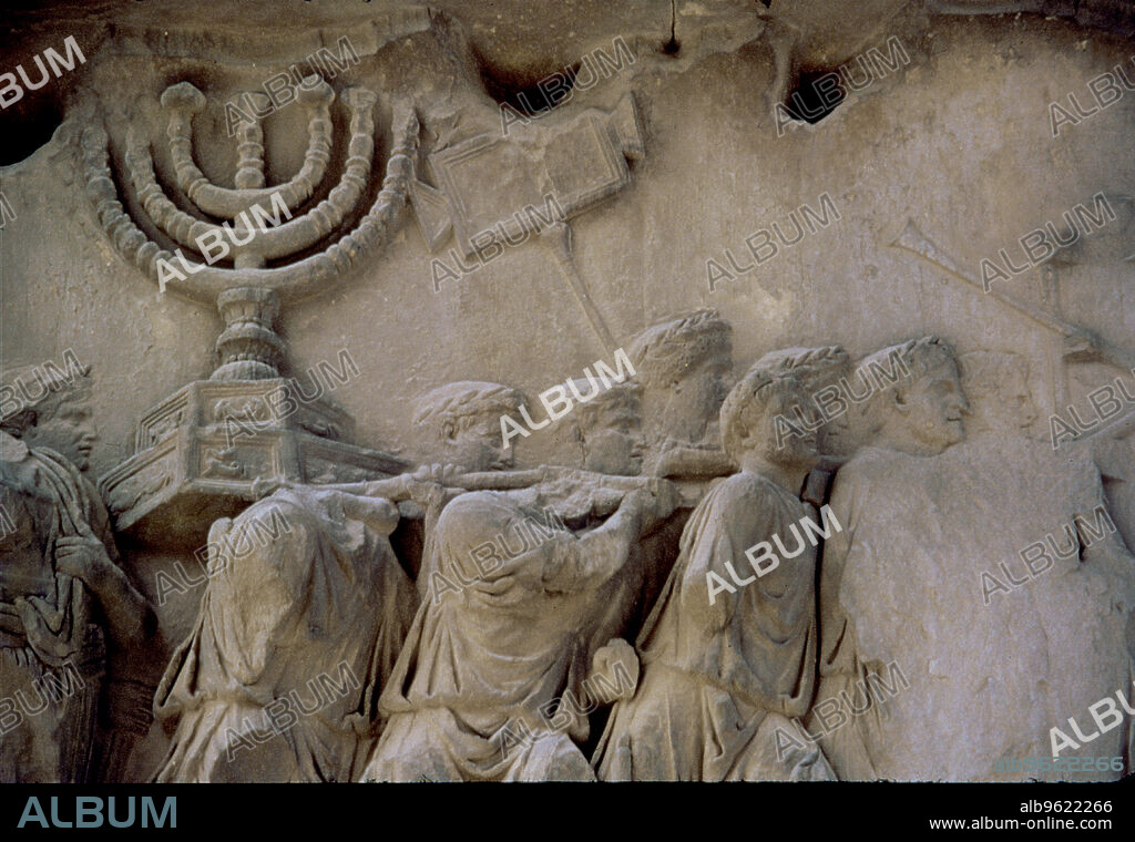 Basrelief in the Arch of Titus representing men carrying a menorah, located in the Via Sacra of the Rome Forum.