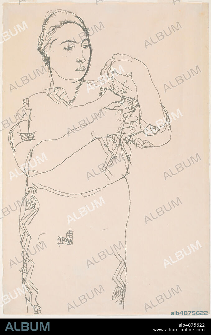 Egon Schiele, Standing Woman, Study for 'Portrait of Friederike Beer-Monti', 1914, graphite on paper, 19 in. x 7 1/2 in. (48.2 cm. x 19 cm.), Friederike Maria Beer, the subject of this portrait, is the only person to be painted in oil by both Gustav Klimt and Egon Schiele. An ardent fan of the Wiener Werkstatte, Beer recalled that all her clothing was designed by their fashion department. The Werkstätte's distinctive fabric patterns are recognizable in both the Schiele and the Klimt portraits. However, Schiele apparently had trouble building a composition around the? zigzag stripes of Beer's dress. Nine studies are known to survive: eight in pencil and one with gouache additions. Schiele tried out various other poses: for example, arms folded, or grasping her forehead. In this drawing, Schiele seems to have caught his subject in motion, perhaps shifting from one position to the next. The artist drew with stop-action precision and often captured his subjects on the fly. The pensive look on Beer's face here suggests she is focusing on some unseen object or is lost in unfathomable thoughts.