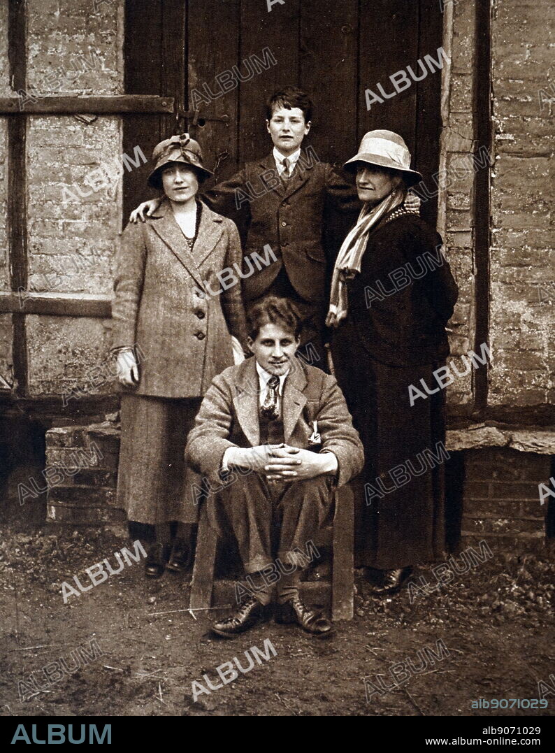 photograph taken at the Hertfordshire home of the Earl of Strathmore of Lady Elizabeth Bowes Lyon, (later Queen Elizabeth the Queen Mother) with Prince Paul of Yugoslavia, Lady Elizabeth's mother, and (seated) The Hon David Bowes Lyon, Lady Elizabeth's youngest brother 1920.