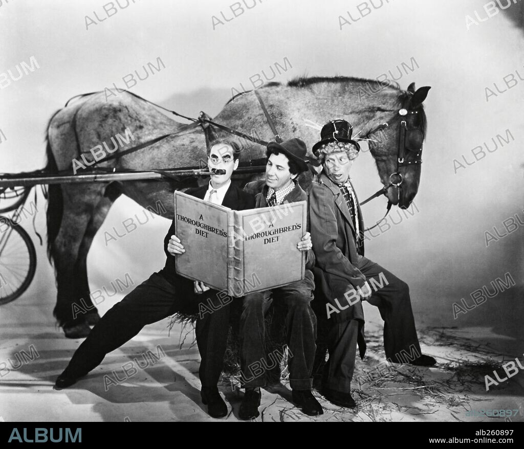 LOS HERMANOS MARX, CHICO MARX, GROUCHO MARX and HARPO MARX. CHICO MARX, GROUCHO MARX, HARPO MARX and THE MARX BROTHERS in A DAY AT THE RACES, 1937, directed by SAM WOOD. Copyright M.G.M.