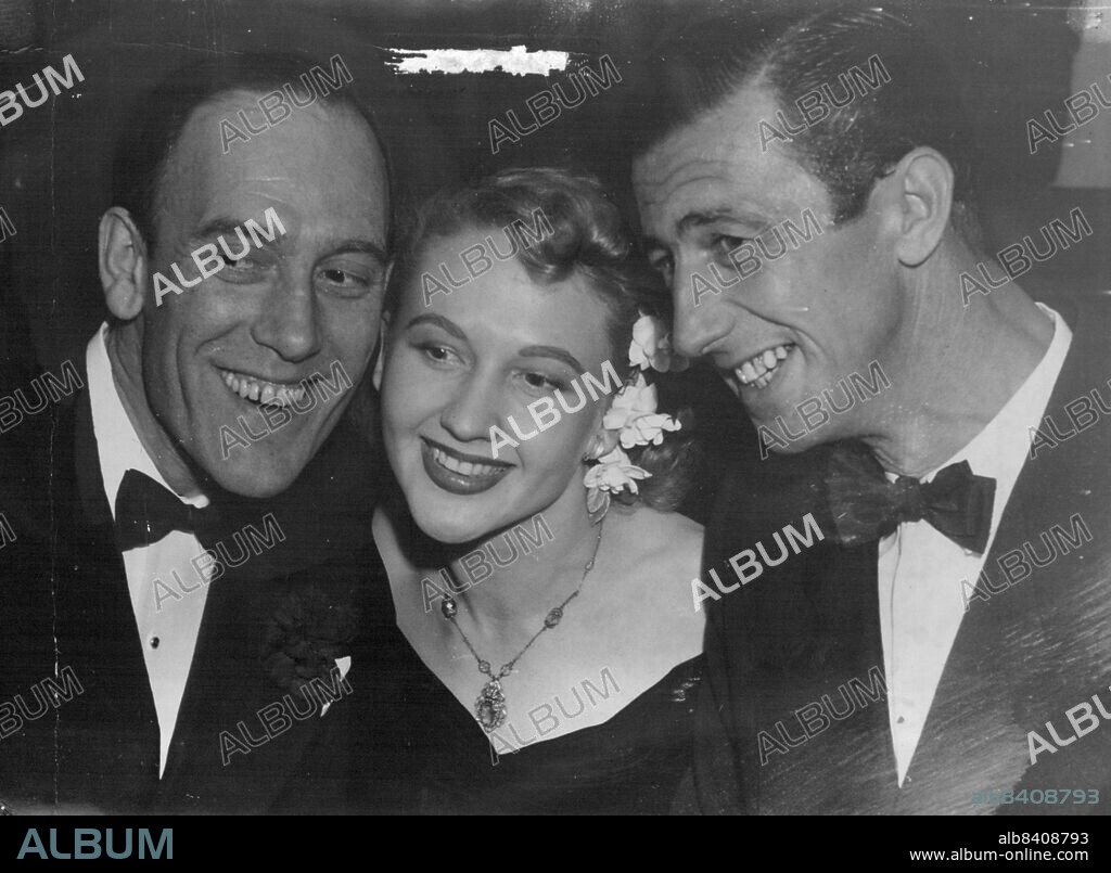 Film Premier - At the premiere last night of Eureka Stockade. English comedian Tommy Trinder (left), new Australian find Noni Piper, and Chips Rafferty (star of the film). These three* will star in the new Ealing film Bitter Springs. May 7, 1949.