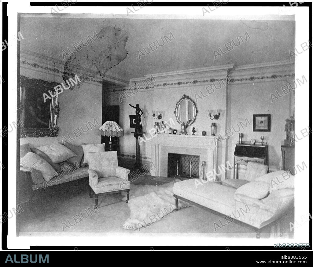 FRANCES BENJAMIN JOHNSTON. Bedroom with fireplace, padded chaise longue, sofa, male nude statuette, and polar bear rug, in home of Edmund Cogswell Converse, Greenwich, Connecticut, 1908. The Conyers Farm estate, designed by Donn Barber c1904, was owned by businessman Edmund C. Converse.