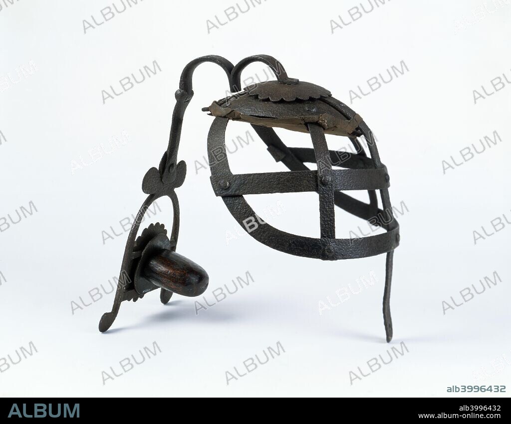 Scold's Bridle, late 16th century. This unpleasant instrument of punishment reserved for women prisoners originated in medieval Scotland. It consisted of a metal head cage with a built in gag.