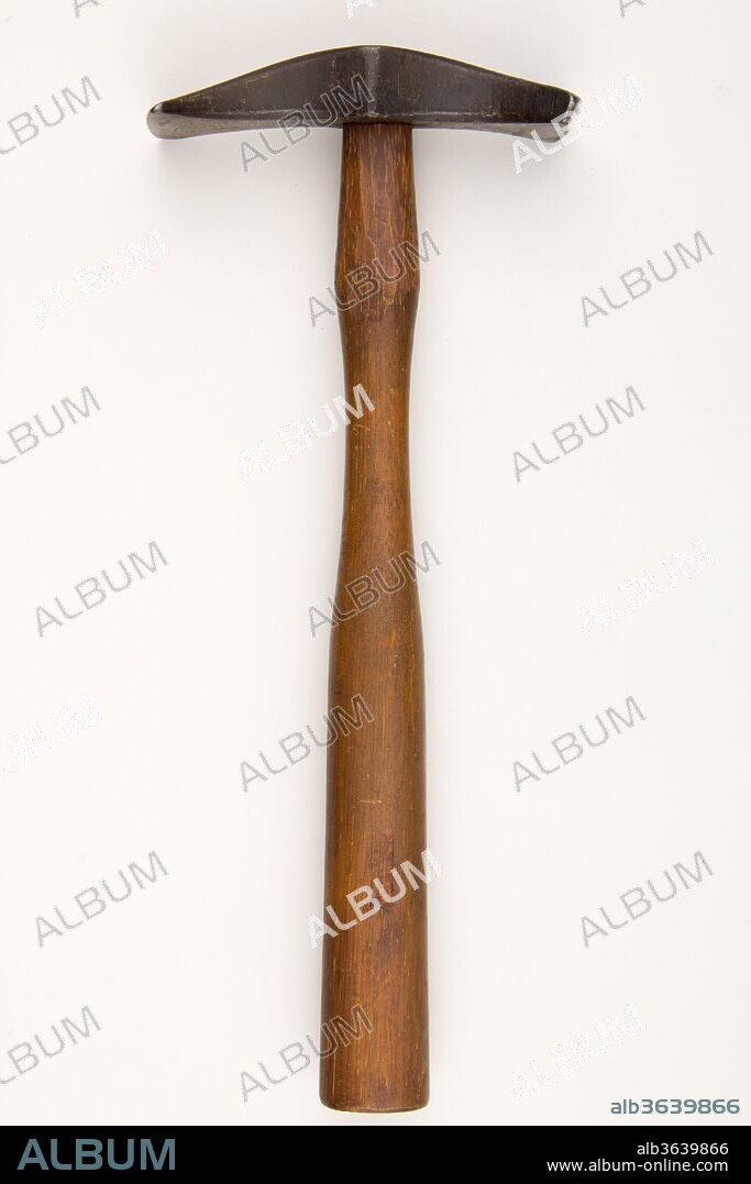 Armorer's Hammer. Culture: German or French. Dimensions: H. 12 in. (30.5 cm); W. of head 5 in. (12.7 cm); Wt. 14.9 oz. (422.4 g). Date: 18th-19th century.
This hammer is among the 644 pieces that make up the very specialized outillage (set of tools) brought from Paris to New York by the armorer Daniel Tachaux (1857-1928) in 1909, when he was hired to repair and maintain the Museum's arms and armor collection. Hammer heads and stakes of many different sizes, shapes, and weights are necessary to create the complex forms of different weapons and pieces of armor. Tachaux trained in Paris under the German armorer Ludwig Klein (about 1830-1882) and inherited his teacher's tools, which he combined with his own. The set, possibly the most complete of its kind in existence, was purchased by the Metropolitan Museum in 1912 at the request of the Arms and Armor Department's founding curator Bashford Dean.