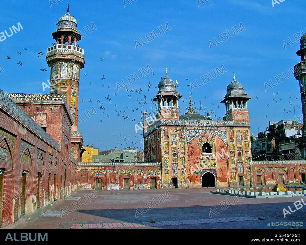 The Wazir Khan Mosque (Masjid Wazir Khan) in Lahore, Pakistan, is celebrated for its extensive faience tile work. It has been described as 'a beauty spot on the cheek of Lahore'. It was built in seven years, starting around 1634-1635, during the reign of the Mughal Emperor Shah Jehan. It was built by Shaikh Ilm-ud-din Ansari, a native of Chiniot, who rose to be the court physician to Shah Jahan and later, the Governor of Lahore. He was commonly known as Wazir Khan. The mosque is located inside the Inner City and is easiest accessed from Delhi Gate. Public Domain image by Guilhem Vellut. (Photo by: Guilhem Vellut/Pictures From History/Universal Images Group via Getty Images).