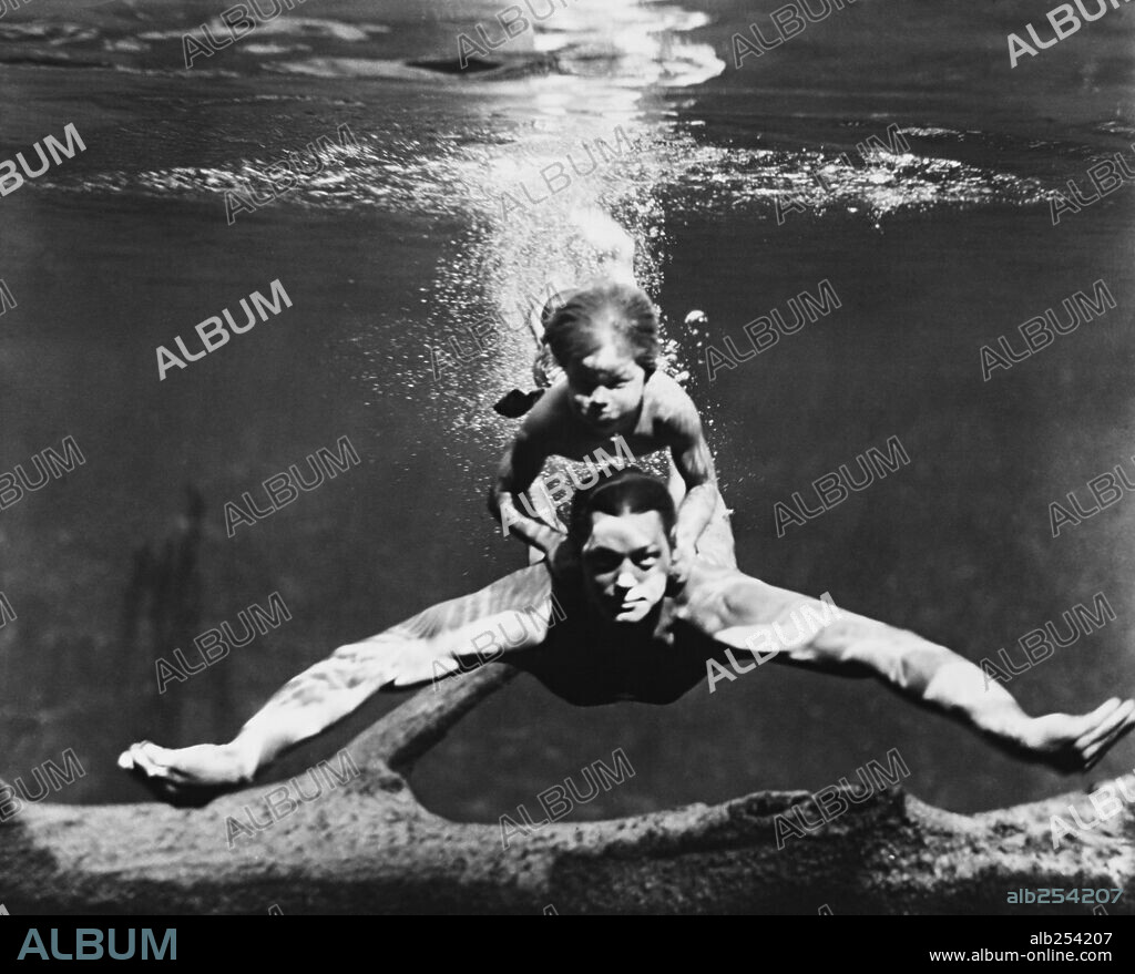 JOHNNY SHEFFIELD y JOHNNY WEISSMULLER en TARZÁN Y SU HIJO, 1939 (TARZAN FINDS A SON!), dirigida por RICHARD THORPE. Copyright M.G.M.