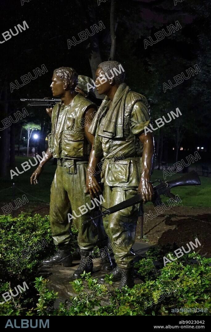 The Three Soldiers at the Vietnam Veterans Memorial in Washington D.C. at night. Dated 21st Century.