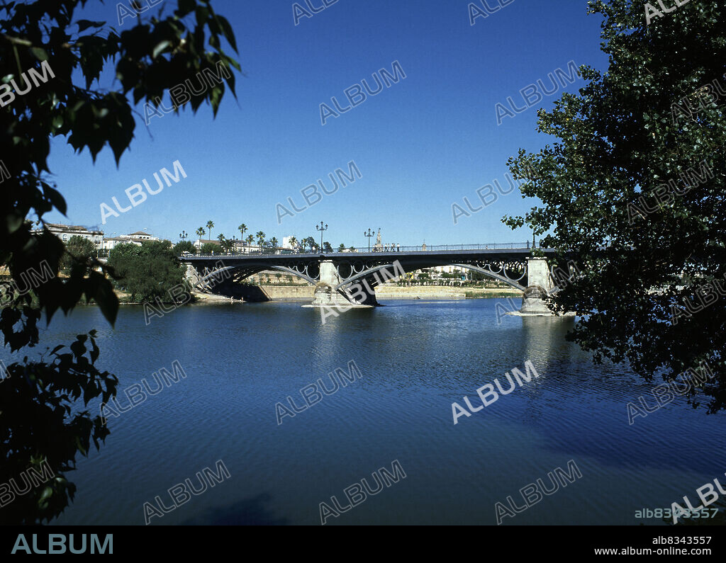 GUSTAVO STEINACHER Y FERDINAND BERNADET. PUENTE DE ISABEL II CONOCIDO POPULARMENTE COMO EL PUENTE DE TRIANA CONSTRUIDO ENTRE 1847 Y 1852.
