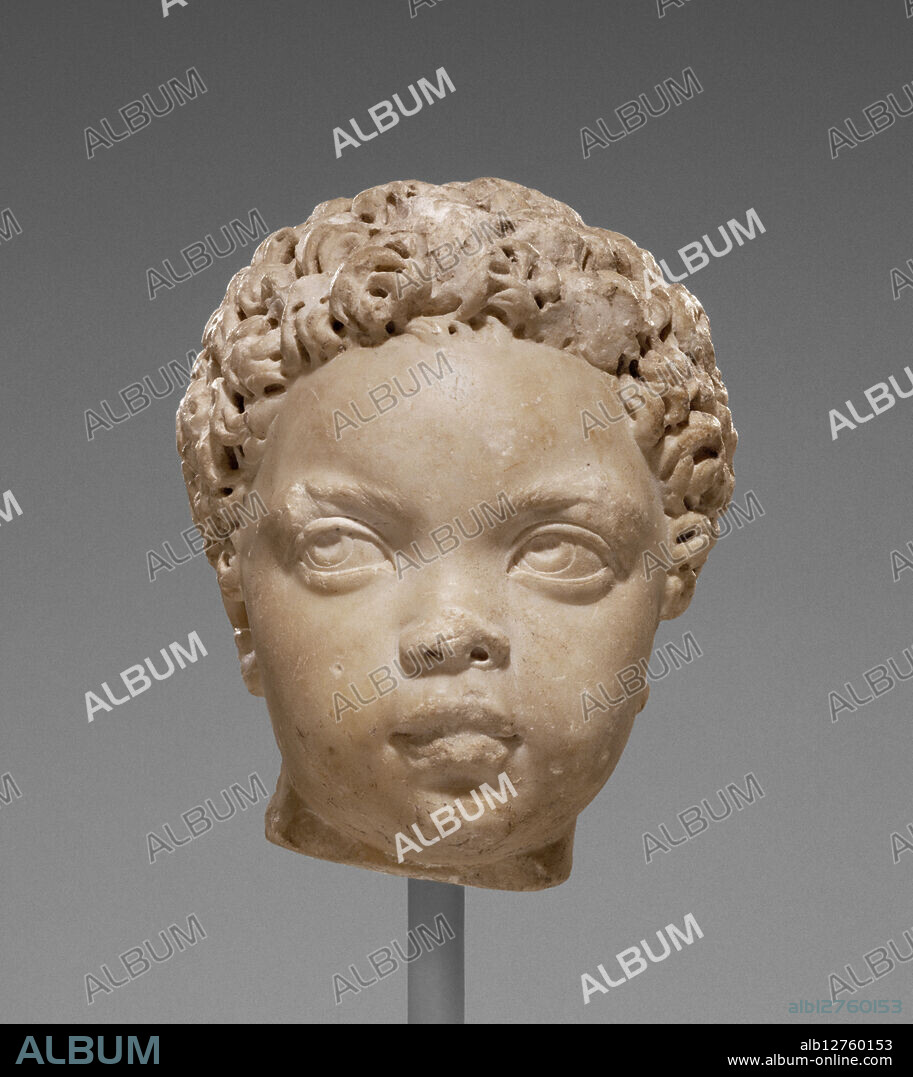 Portrait of a Child, A.D. 150-200.   Additional Info: This child, probably a boy of early toddler age, is among the most sensitive portraits of very young children known in Roman art. Broken at the neck, the head would have sat on a full-length statue or a bust. Several features of this portrait are characteristic of Roman sculpture in the Antonine period (A.D. 138-192), such as the interest in observing personality, depicting movement, and contrasting textures such as the polished skin and the impressionistic rendering of the hair. The boy’s tight curls and some of his facial features have led some modern viewers to categorize him as a Black African, but given the lack of historical evidence (e.g., an inscription naming him) and non-physical markers of identity (such as clothing), the child’s ethnicity remains uncertain.