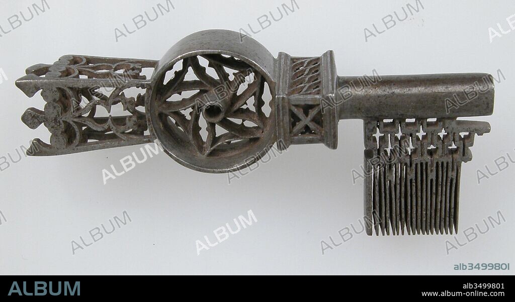 Key, 16th century, French, Iron, Overall: 3 3/8 x 1 7/16 x 1 in. (8.5 x 3.7 x 2.5 cm), Metalwork-Iron, The decoration of Gothic iron locks and keys was often elaborate and of the highest standard of workmanship. The motifs were frequently drawn from Gothic architecture, reproducing on a miniature scale complicated tracery patterns and even tiny statuettes.