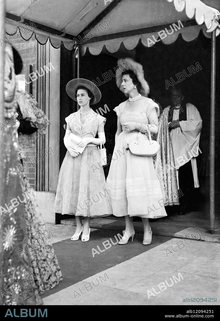 PRINCESS AT THE WEDDING : LONDON: The King and Queen, with Princess Margaret, were guests at the wedding of Lady Caroline Thynne, 21-year-old daughter of the Marquess and Marchioness of Bath, and David Somerset, which took place at St.Peter's, Eaton-square, to-day. Mr Somerset is heir-presumptive to the Duke of Beaufort. For the ceremony the bride wore a white and silver brocade gown patterned with roses. Photo Shows: Princess Margaret with the Duchess of Kent when they attended the wedding of Lady Caroline Thynne and Mr David Somerset at St.Peter's. United Kingdom 1950.