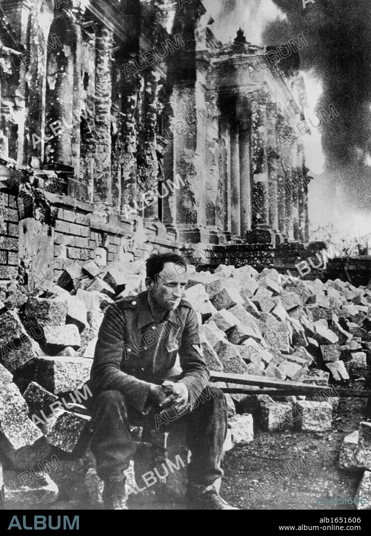 Second World War: German soldier sits amongst the ruins of the Reichstag in Berlin after the Russian army entered the city in 1945.