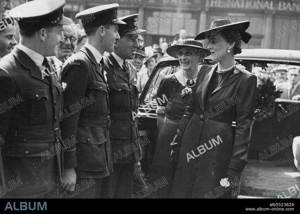 Alexandra Rose Day -- Her Royal Highness the Duchess of Kent visits the flag depot at Australia House, Strand.Duchess of Kent with Mrs. Bruce, wife of the Australian Commissioner, chatting to men of the R.A.A.F. who formed the Guard of Honour. They are Left to right:- P/O. Frank McLoughlin (Abbotsford, N.S.W.), F/O Ron Bint (Perth, W.A.), and F/O. C.K. Smith (Petsworth, Queensland). August 30, 1943. (Photo by Sport & General Press Agency, Limited).