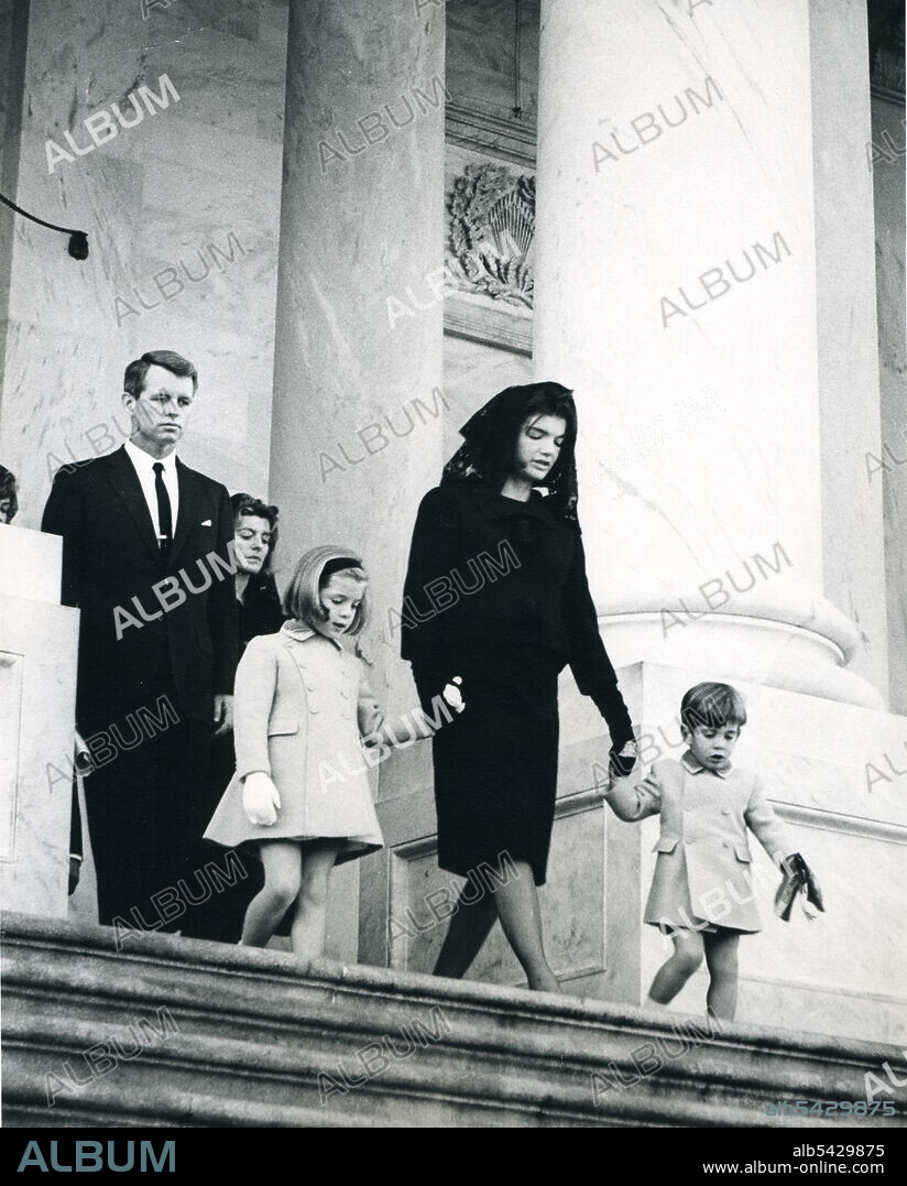 Jacqueline Kennedy, with her children, Caroline and John Jr., leaving the U.S. Capitol after brief service in the Capitol Rotunda. November 24, 1963. Abbie Rowe photographer.