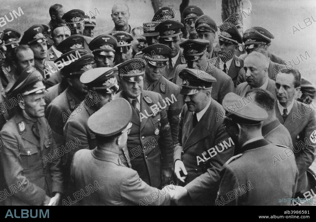 Adolf Hitler meeting with senior Nazis, Germany, August 1944. Hitler saying goodbye to the reichsleiters and gauleiters (senior Nazi officials) after a meeting at his headquarters. The photograph was taken a month after the attempt on Hitler's life. Joseph Goebbels is on the right of the picture.