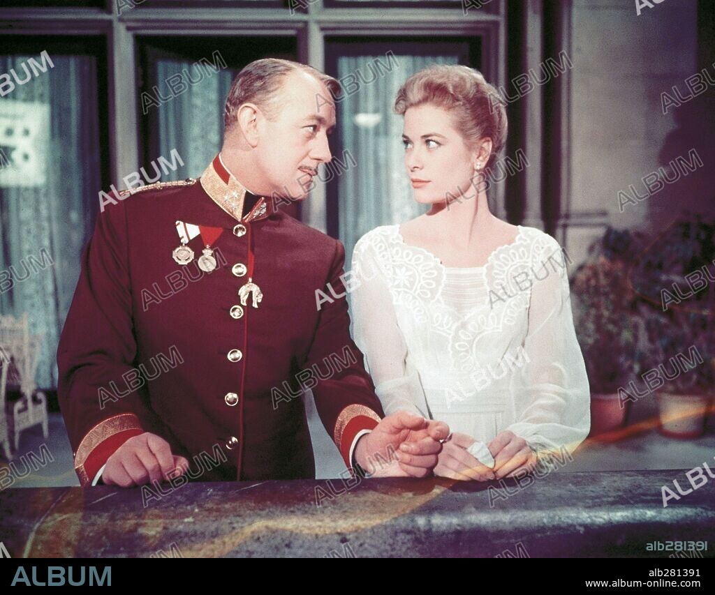 ALEC GUINNESS and GRACE KELLY in THE SWAN, 1956, directed by CHARLES VIDOR. Copyright M.G.M.