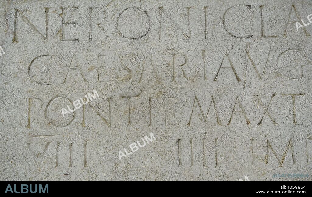 Stone plaque dedicated to emperor Nero (Nero Claudius Caesar Augustus Germanicus)  (37-68 AD) honouring his person and lists his titles: Pontifex Maximus, Tribune, Consul, Emperor and Father of the Homeland. 61-62 AD. Marble. Detail. From the Forum of Augusta Emerita (Merida, Badajoz province, Extremadura, Spain). National Archaeological Museum. Madrid. Spain.