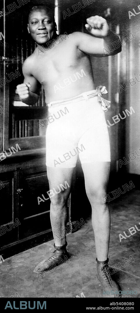 John Arthur Johnson (March 31, 1878 - June 10, 1946) was the first African-American world heavyweight boxing champion (1908-15). He had a unique fighting style, which was not customary to boxing during this time. He would fight defensively, waiting for his opponents to tire out. He would continuously dodge their punches, and quickly strike back with a blow of his own. He often made his fights look effortless, but when pushed he could also display some powerful moves, and punches. He was an early example of the celebrity athlete in the modern era, appearing regularly in the press and later on radio and in motion pictures. On June 10, 1946, he died in a car crash after racing angrily from a diner that refused to serve him. He was 68 years old. During his boxing career, he fought 114 fights, winning 80 matches, 45 by knockouts. He was inducted into the Boxing Hall of Fame in 1954, and is on the roster of both the International Boxing Hall of Fame and the World Boxing Hall of Fame. Bain News Service, 1910-15.