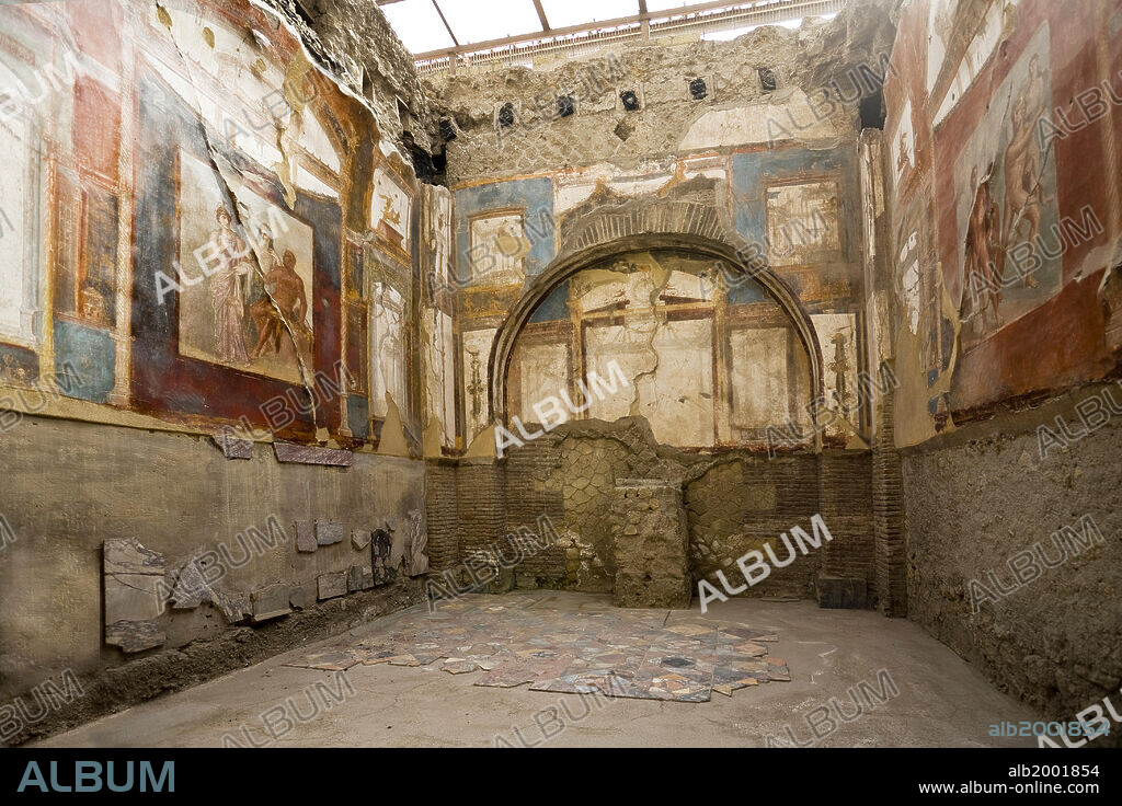 After the eruption of Mount Vesuvius in 79 AD, the town of Herculaneum was buried under the volcanic debris. The debris kept the town well preserved until it was excavated in the 18th century. The Temple of the Augustales belonged to the priests of the Imperial Cult. Many of its original frescoes survive, and they depict scenes from the last episodes of the Hercules myths. The college also retains its original flooring of opus sectile. Herculaneum was declared a World Heritage Site by UNESCO in 1997 (Archaeological Areas of Pompeii, Herculaneum and Torre Annunziata).