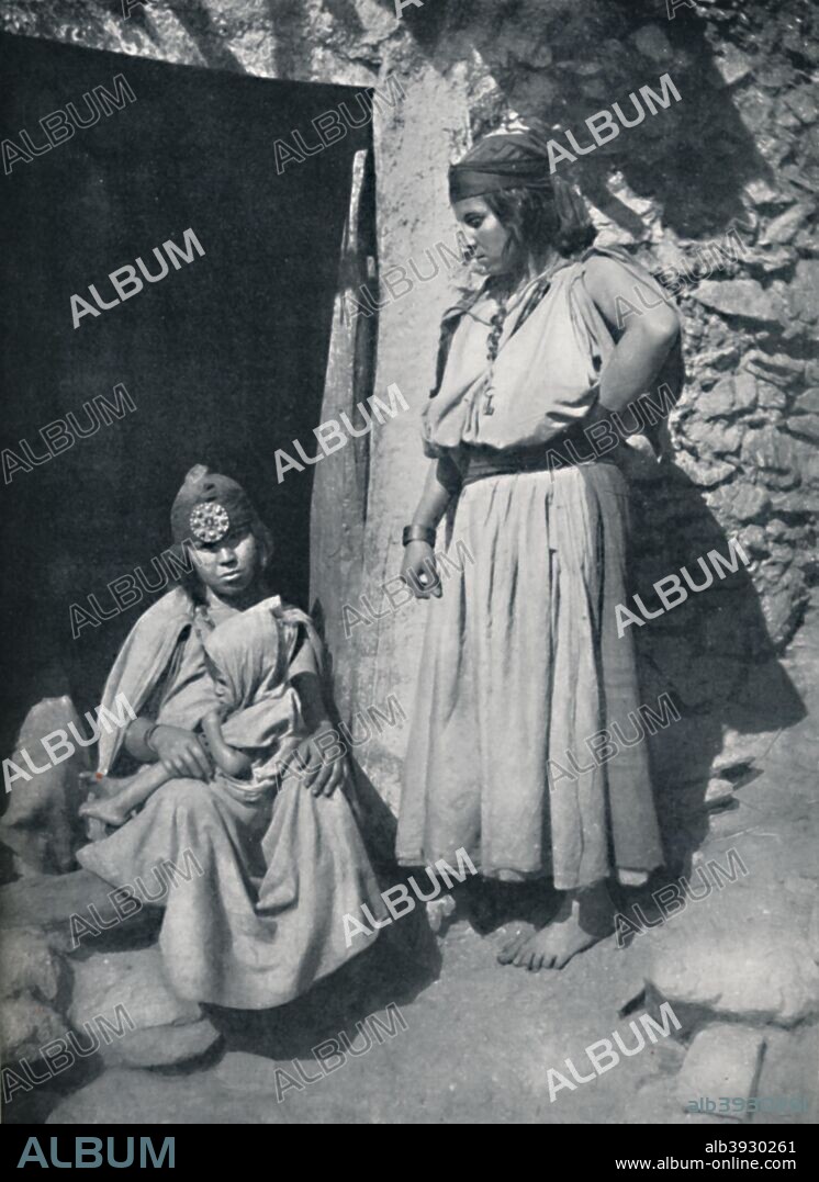 Kabyle women at the door of their dwelling near the Mediterranean coast, Algeria, 1912. From The Living Races of Mankind, Vol. II. [Hutchinson & Co, London, 1912].
