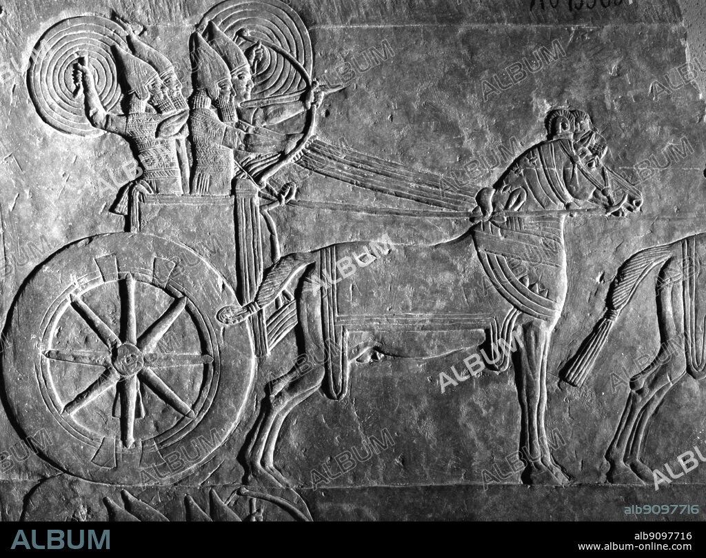 Assyrian relief from the Palace of Ashurbanipal : Mesopotamian chariot , 7th Century BC.