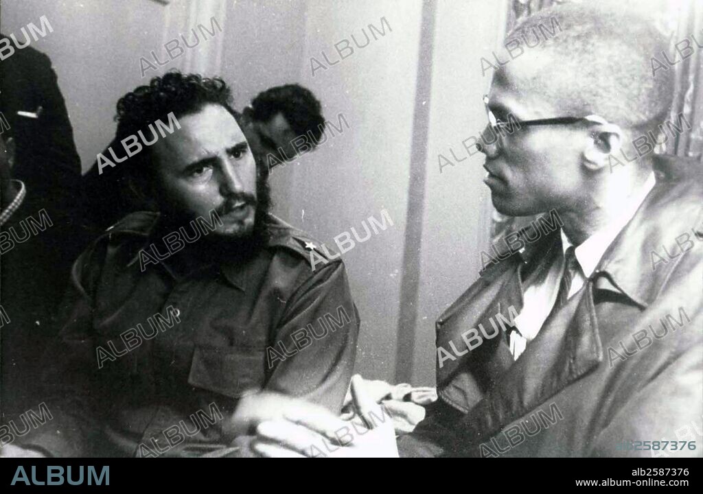 Photograph of a meeting in Harlem with Fidel Castro (1926-) and Malcolm X (1925-1965). Dated 1960 .