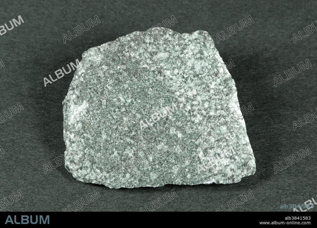 Hand sample of Diorite, an intrusive igneous rock consisting of sodic plagioclase feldspar and hornblende, biotite or pyroxene. Small amounts of quartz may be present. Diorite has phaneritic texture; mineral grains are of nearly equal size and are visible to the naked eye.