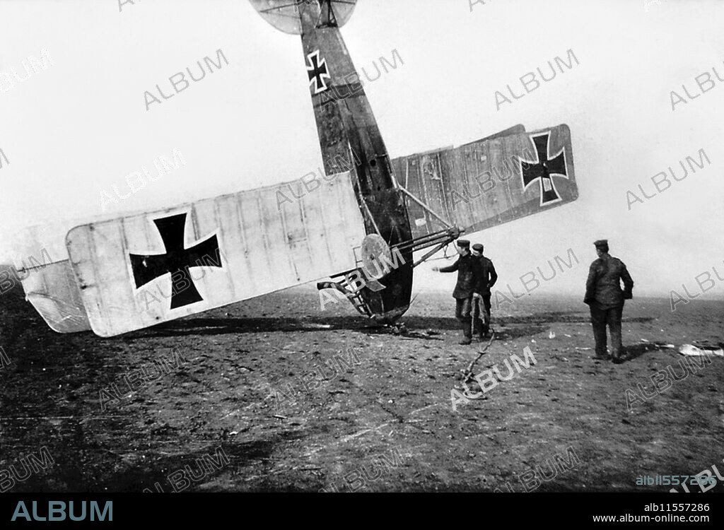 CC BY SA CAROLA EUGSTER. German soldiers attend to an up-ended German aircraft.