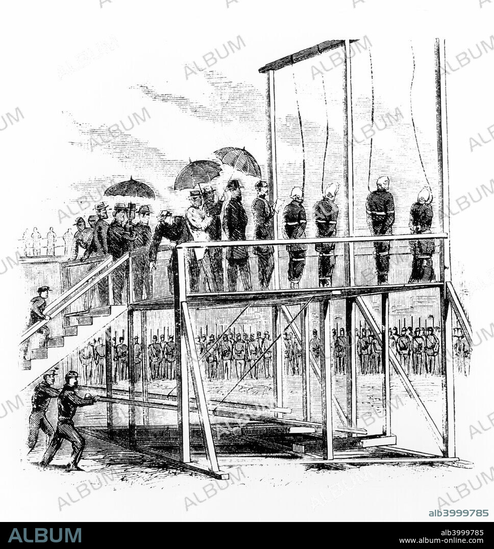 Hanging of the Lincoln assassination conspirators, Washington DC, USA, 7th July, 1865. The assassinination of President Abraham Lincoln by John Wilkes Booth was part of a wider conspiracy. Vice-President Andrew Johnson and Secretary of State William H Seward were also intended to be killed, but survived the attempts on their lives. Booth was killed by US Army soldiers in Virginia, but eight others involved in the conspiracy were arrested and tried by a military court. All the defendants were found guilty, with three sentenced to life imprisonment and one receiving a six year sentence. The other four, Mary Surratt, Lewis Powell, David Herold, and George Atzerodt, were sentenced to death and were hanged at the Old Arsenal Penitentiary.